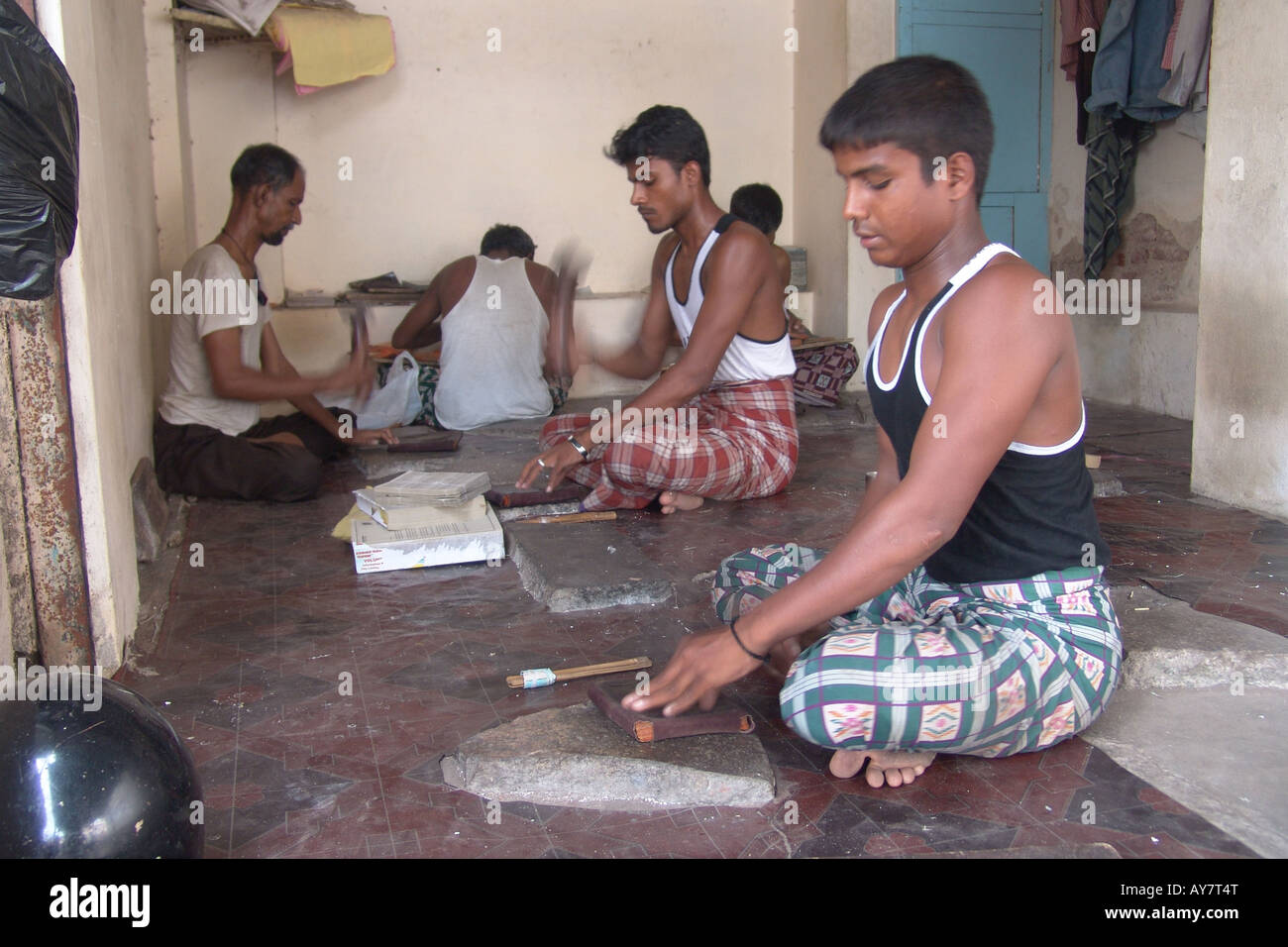 Workers making silver leaf or foil for fruits and sweets Stock Photo Alamy