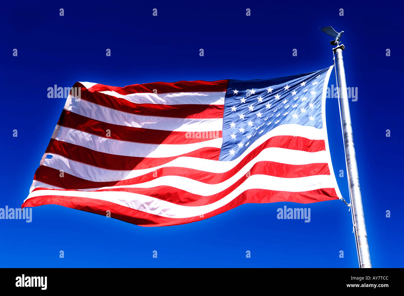 The American Flag on a beautiful sunny day against a bright blue sky Stock Photo
