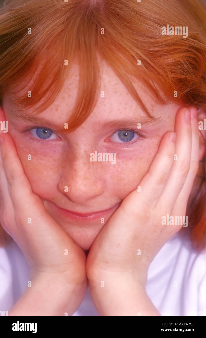 A portrait of a young American girl with Irish red hair, blue eyes and freckles, in  Ruidoso, New Mexico. Stock Photo