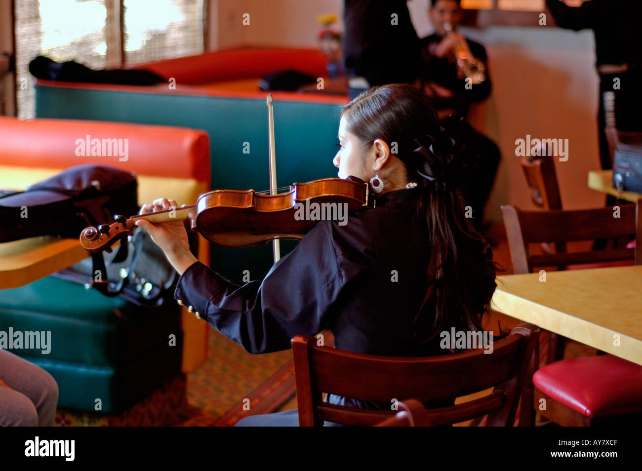 Female musician playing violin at Mexican mariachi band Stock Photo