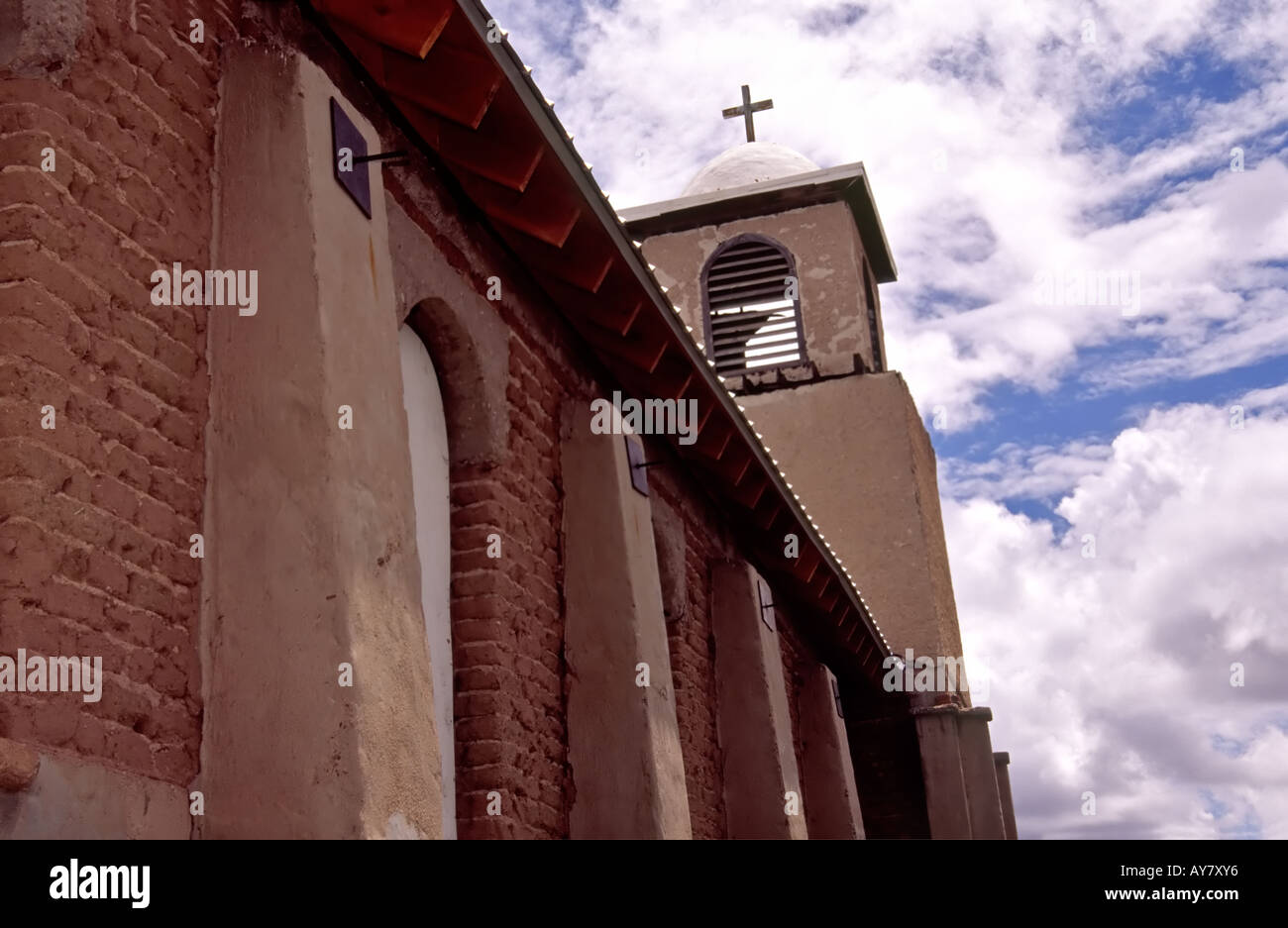 Our Lady of Light church, a fine adobe chapilla (church), is undergoing restoration by volunteers in Lamy, New Mexico. Stock Photo