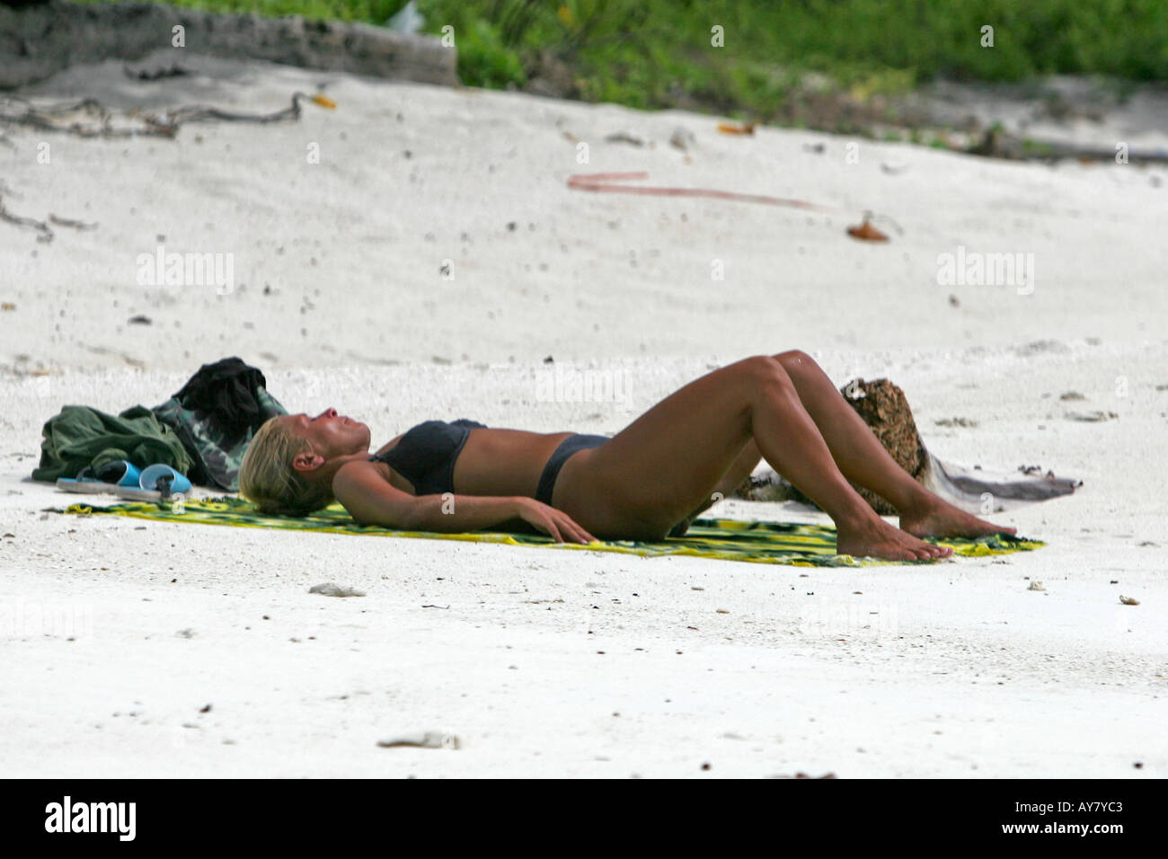 Woman in black bikini sunbathing Pattaya Beach Ko Lipe island Thailand  Stock Photo - Alamy