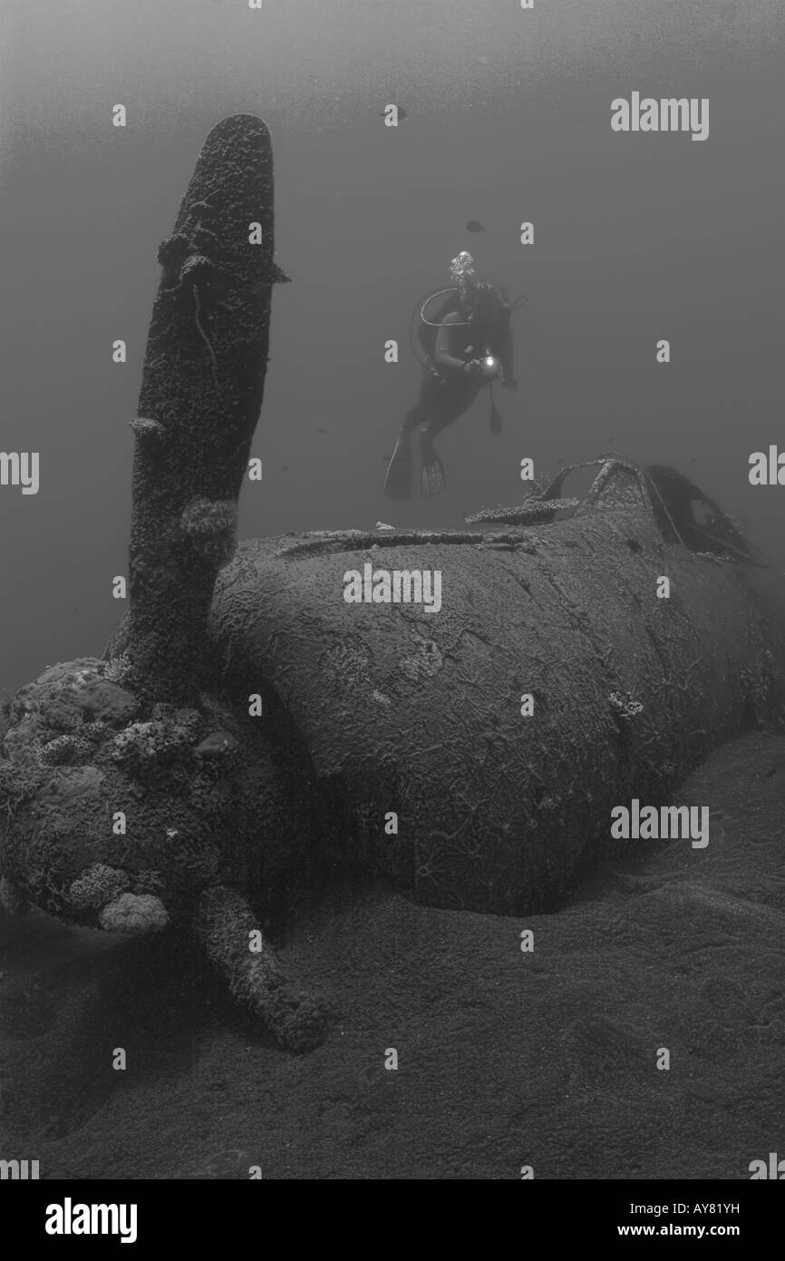 Diver over Japanese Zero wreck in Papua New Guinea Stock Photo
