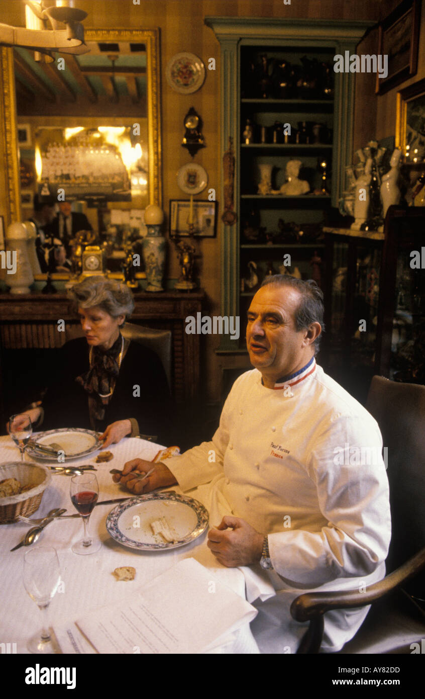 French chef portrait Paul Bocuse in Lyon, France with wife in their private apartment, having lunch. 1980s, HOMER SYKES Stock Photo