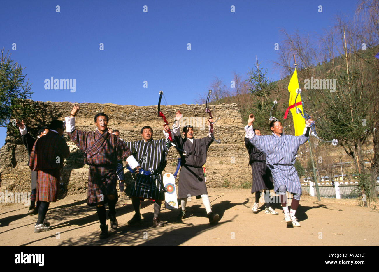 Bhutan Thimpu sport Archers celebrating after successful shot with traditional dance Stock Photo