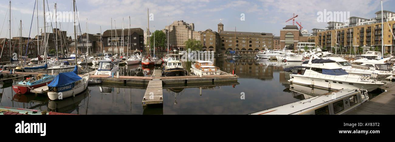 London St Katharines Dock boats and apartments in inner basin panoramic Stock Photo