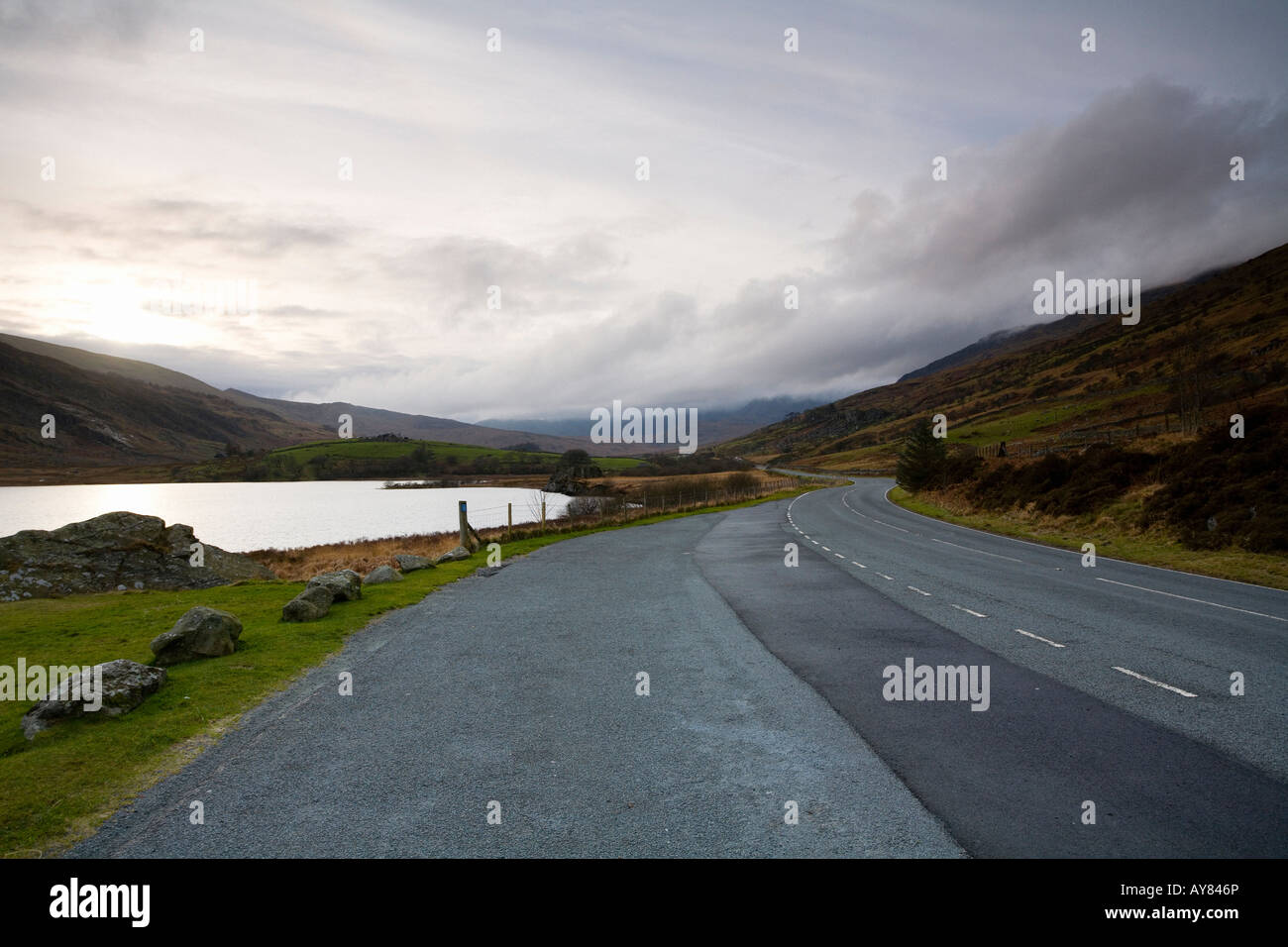 Empty Lonely road winding through Snowdonia Wales UK Stock Photo