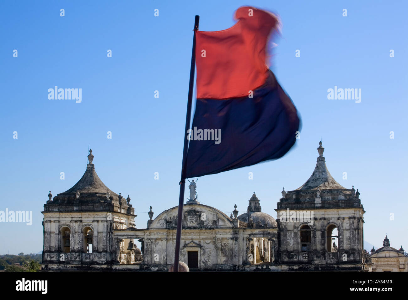 Sandinista FSLN black and red flag plus cathedral Leon Nicaragua Stock Photo