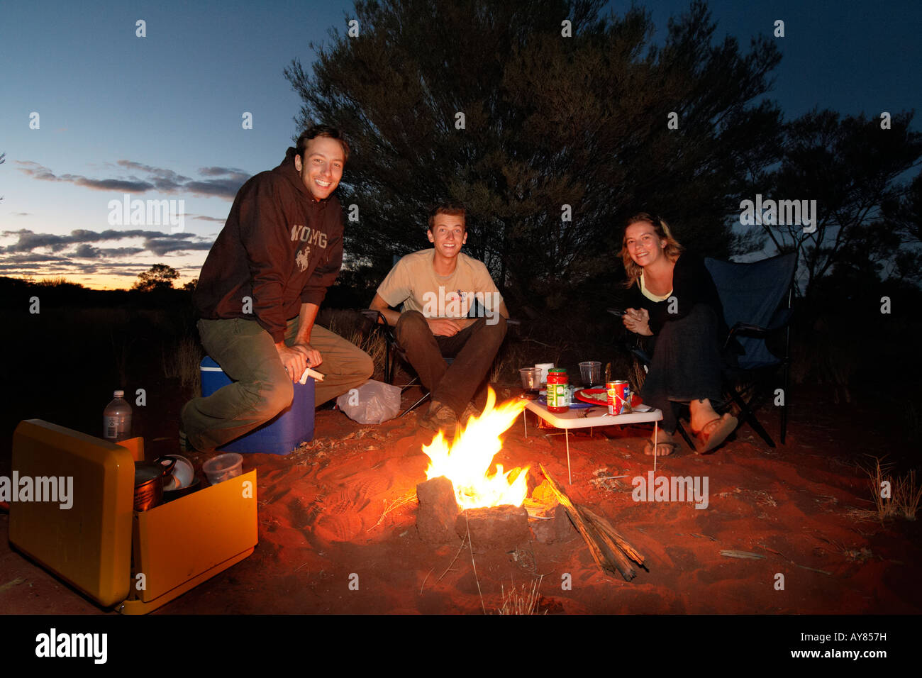backpackers having diner around campfire in the australian bush, south australia, australia Stock Photo