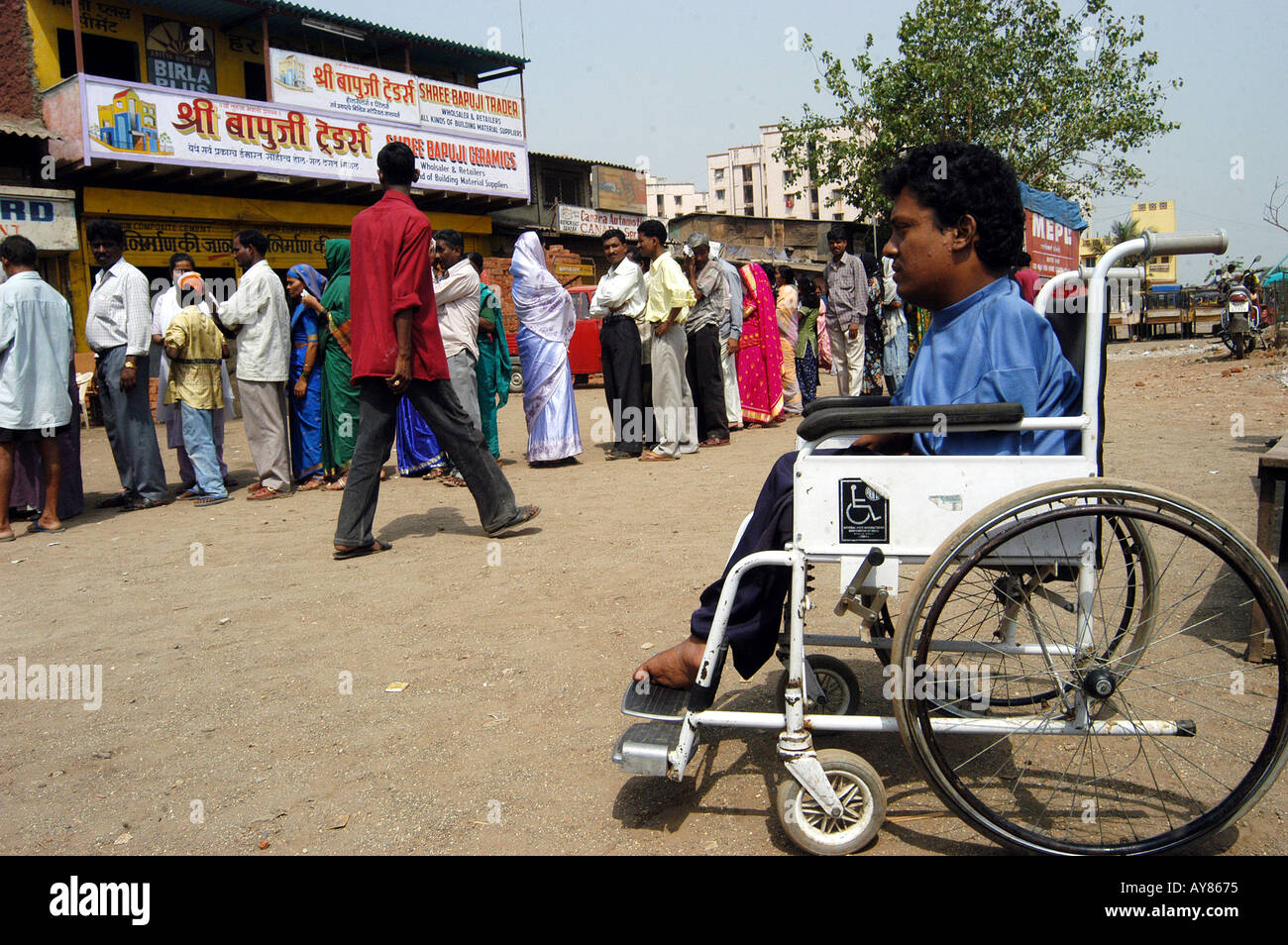 Person in wheel chair to cast vote in Indian elections Stock Photo