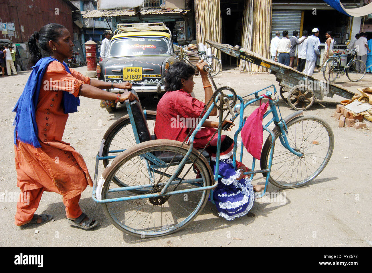 Person in wheel chair to cast vote in Indian elections Stock Photo