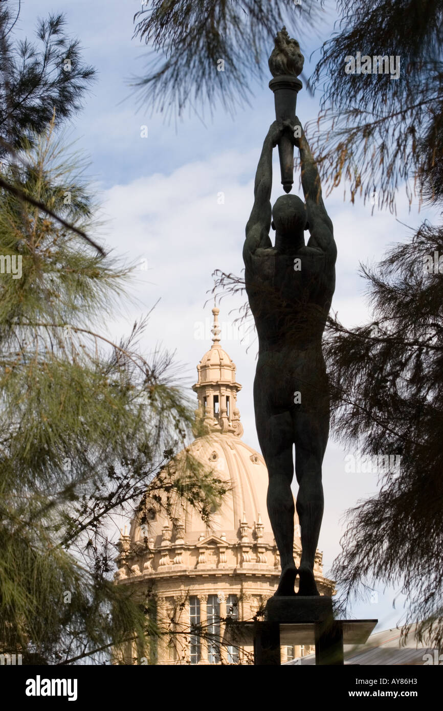 Statue of athlete offering Olympic flame in Montjuic Palace Barcelona ...