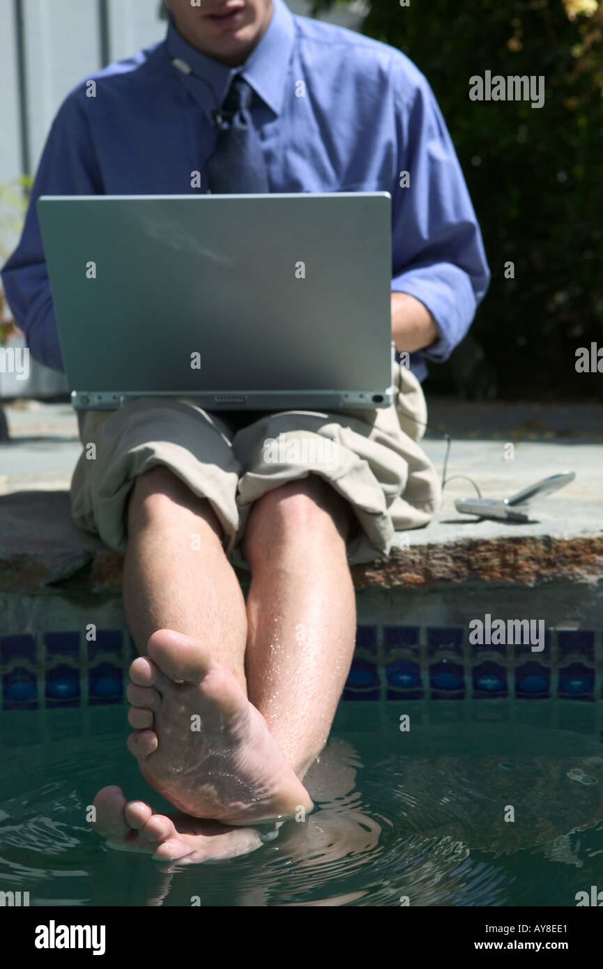 Family sitting near pool hi-res stock photography and images - Alamy