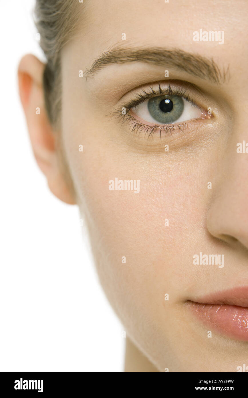 Woman's face, looking at camera, cropped view, close-up Stock Photo