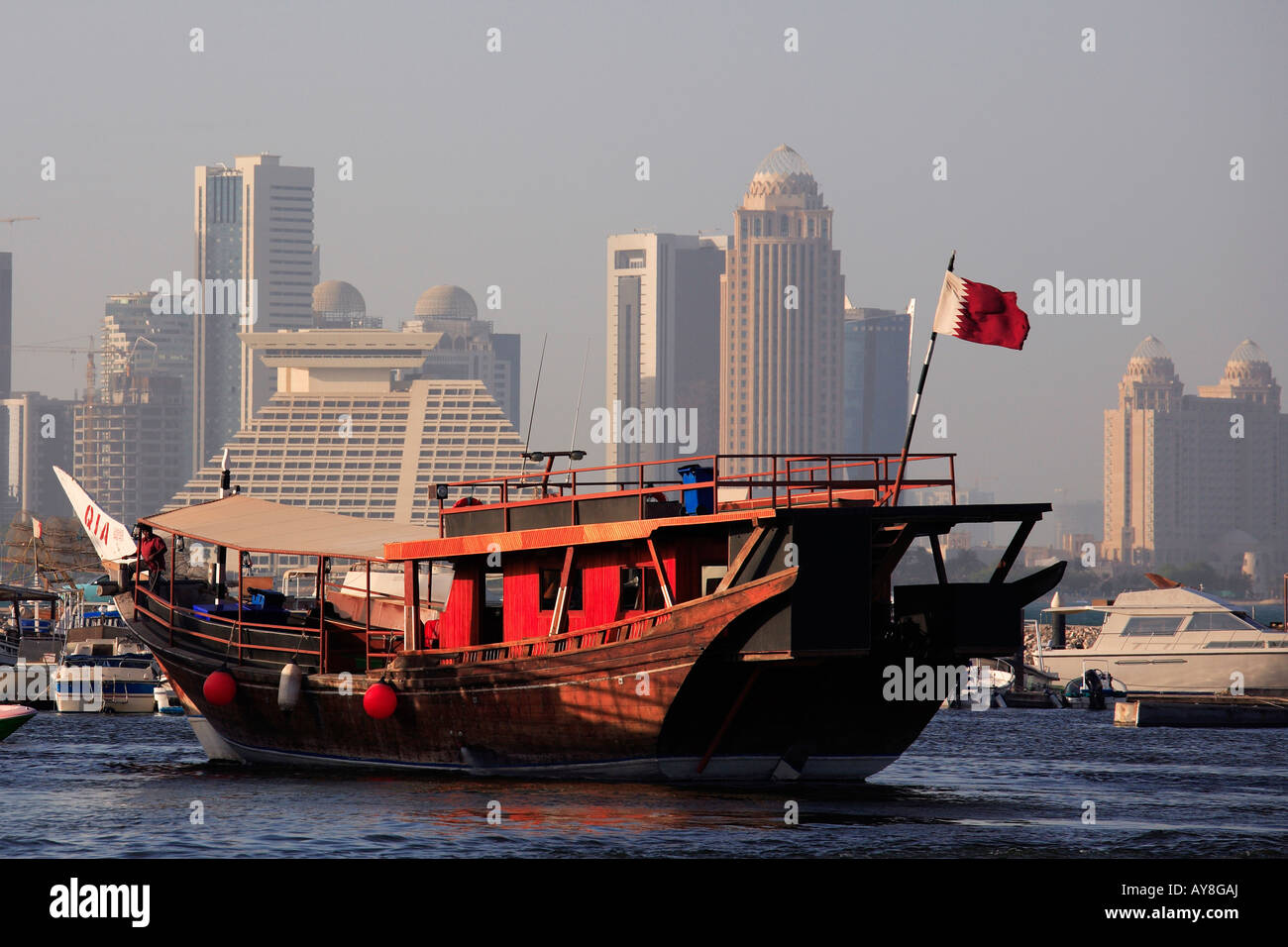 Qatar Doha skyline traditional dhow boat harbour Stock Photo