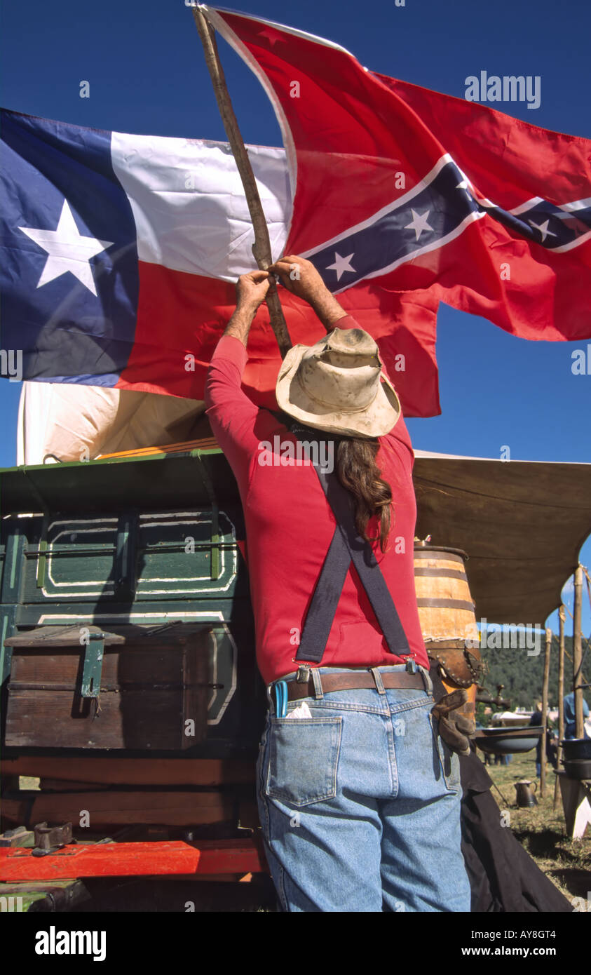 Flags of Texas and the Confederacy fly in the breeze, at the Lincoln County Cowboy Symposium, in Ruidoso Downs, New Mexico. Stock Photo