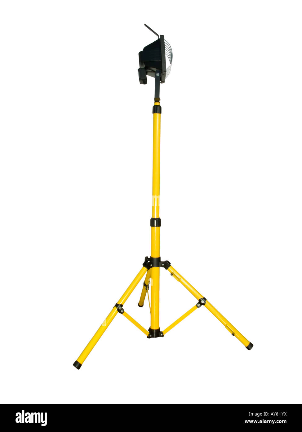 Halogen projector mounted on a tripod isolated on white background ...