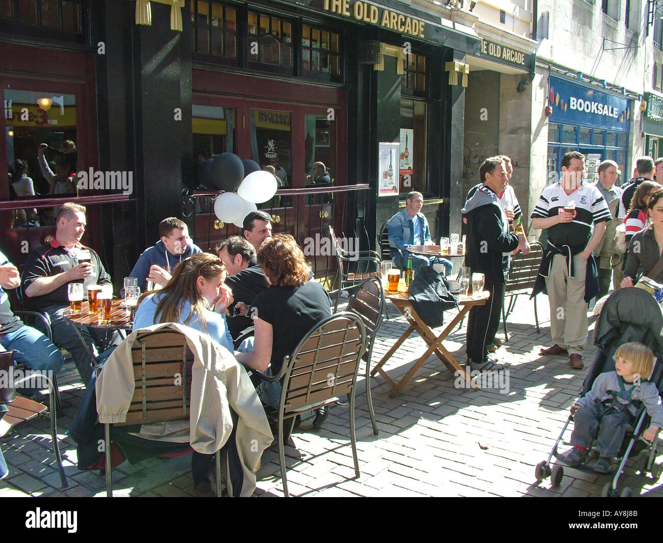 Rugby fans drinking outside the Old Arcade, Cardiff City Centre, Wales Stock Photo