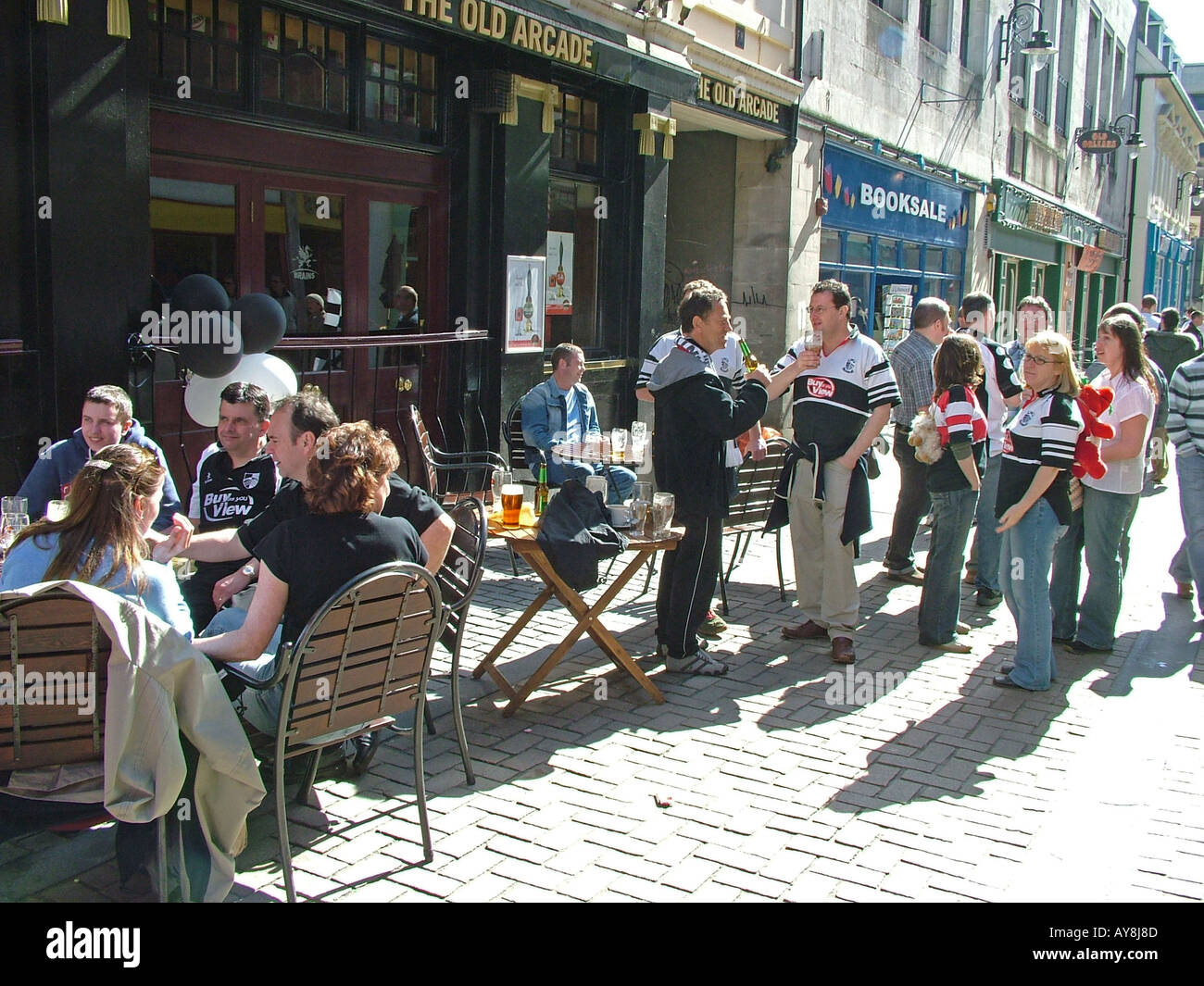 Rugby fans drinking outside the Old Arcade, Cardiff City Centre, Wales Stock Photo