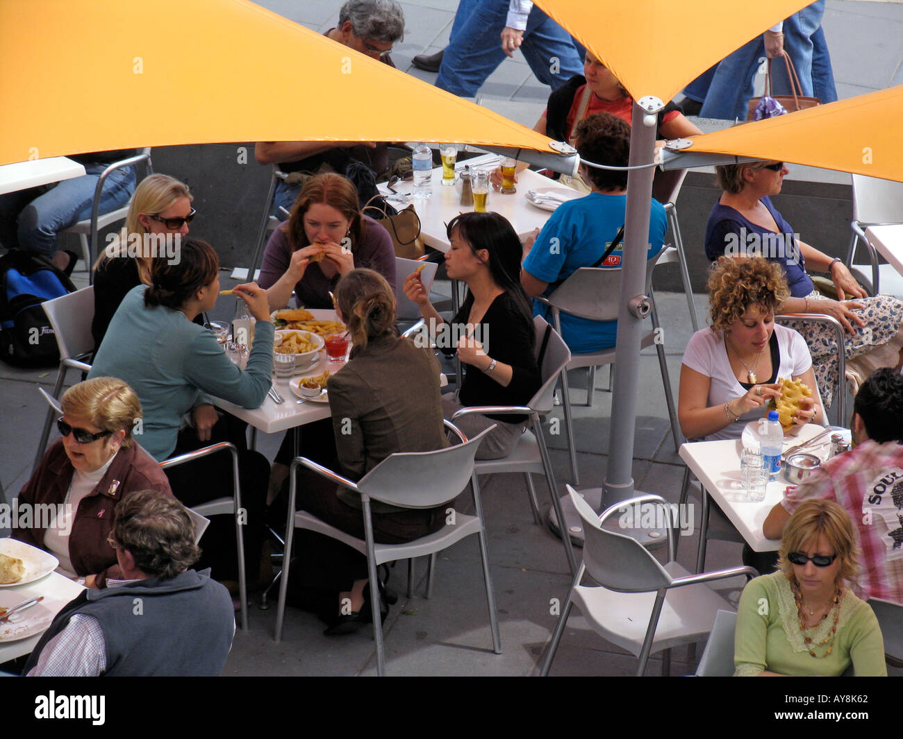 Lunch time diners Federation Square Melbourne Victoria Australia Stock