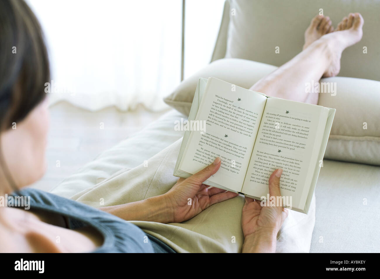 Woman reading, over the shoulder shot Stock Photo
