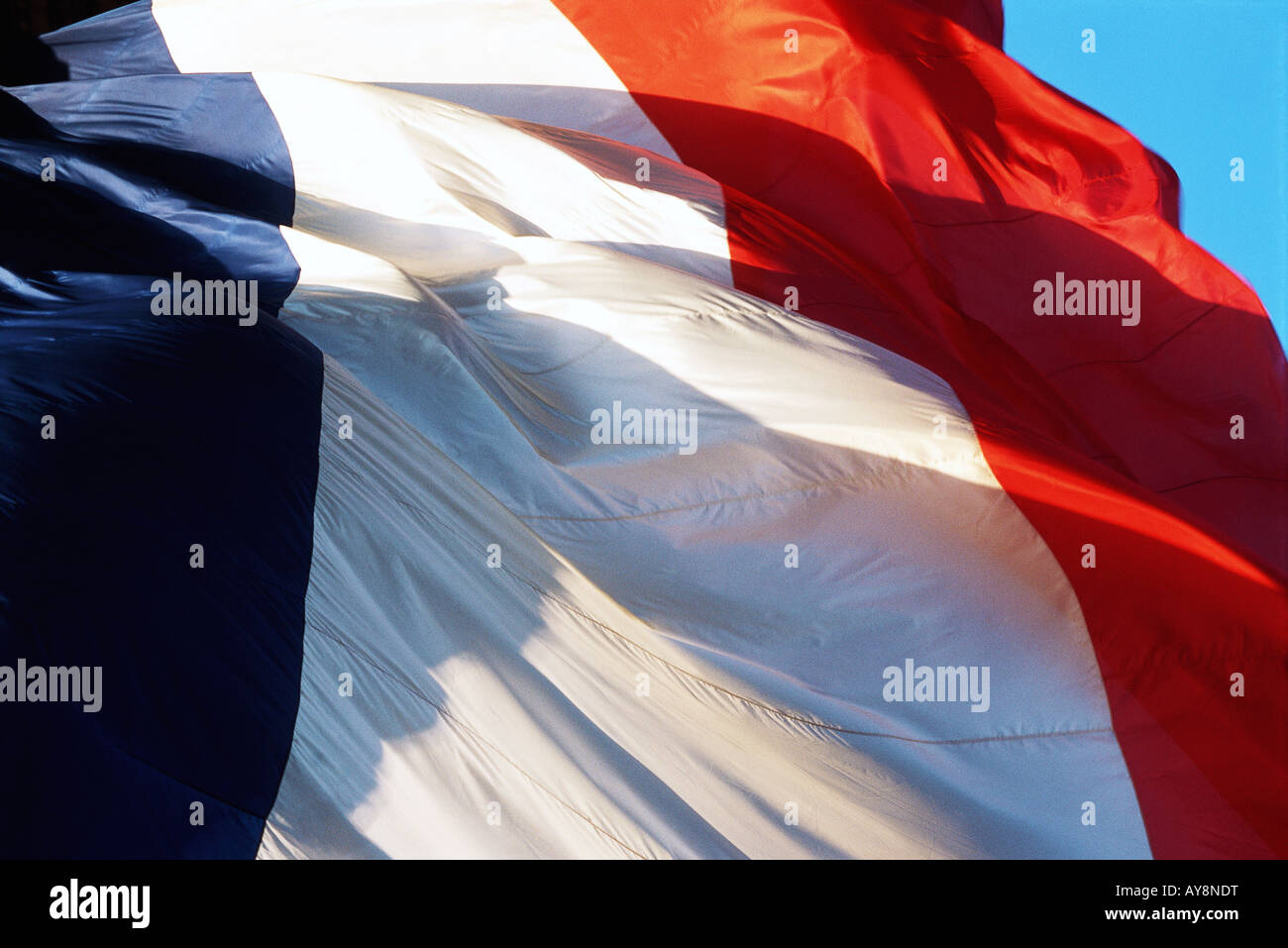 French flag rippling in wind, close-up, cropped Stock Photo