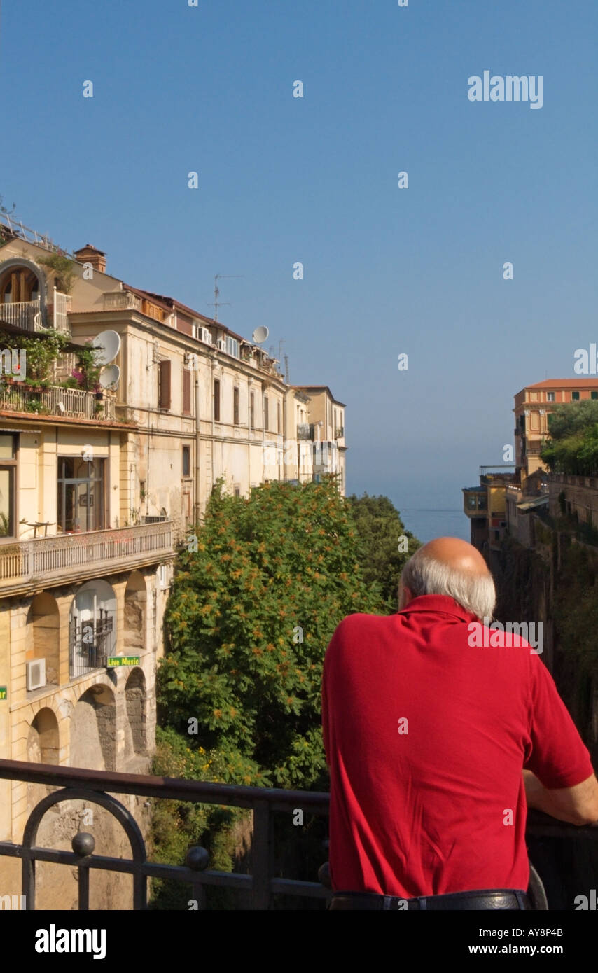 Tourist looking down into Via Luigi de Maio from Piazza Tasso, Sorrento