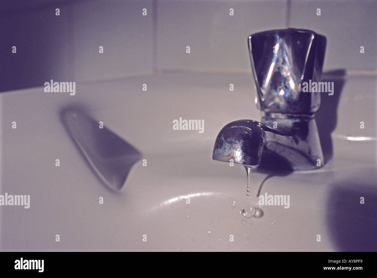 "Dripping "chrome tap", bathroom sink Stock Photo Alamy