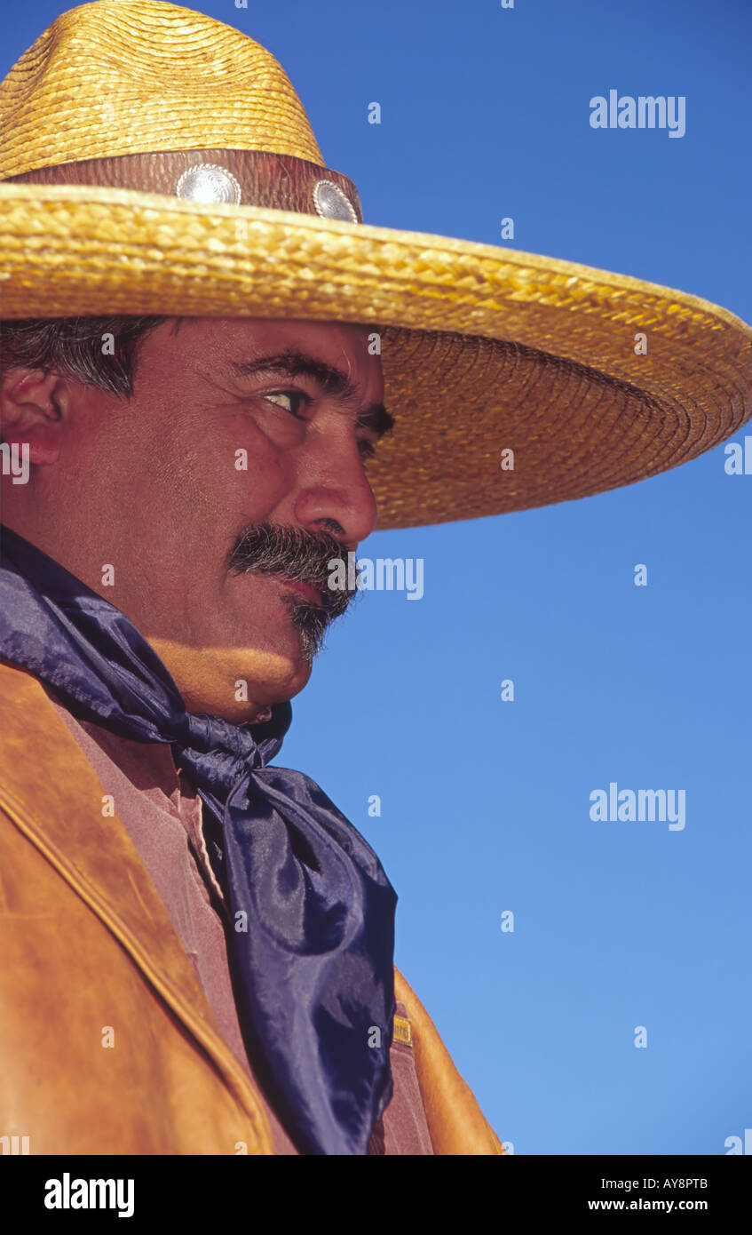 A Hispanic chuck-wagon owner sports a huge sombrero, at the Lincoln County Cowboy Symposium, in  Ruidoso Downs, New Mexico. Stock Photo