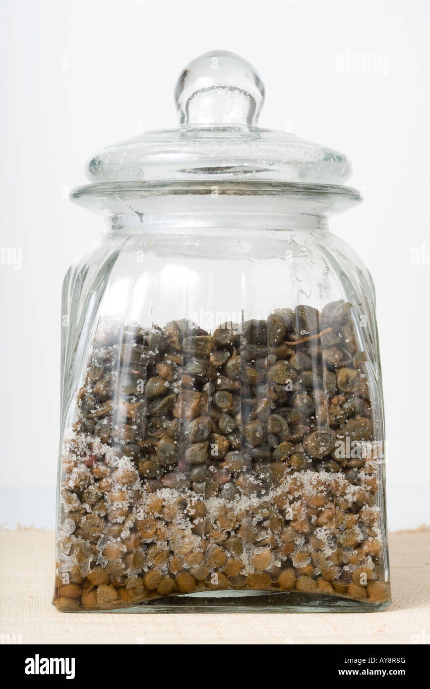 Salted capers in jar, closeup Stock Photo Alamy