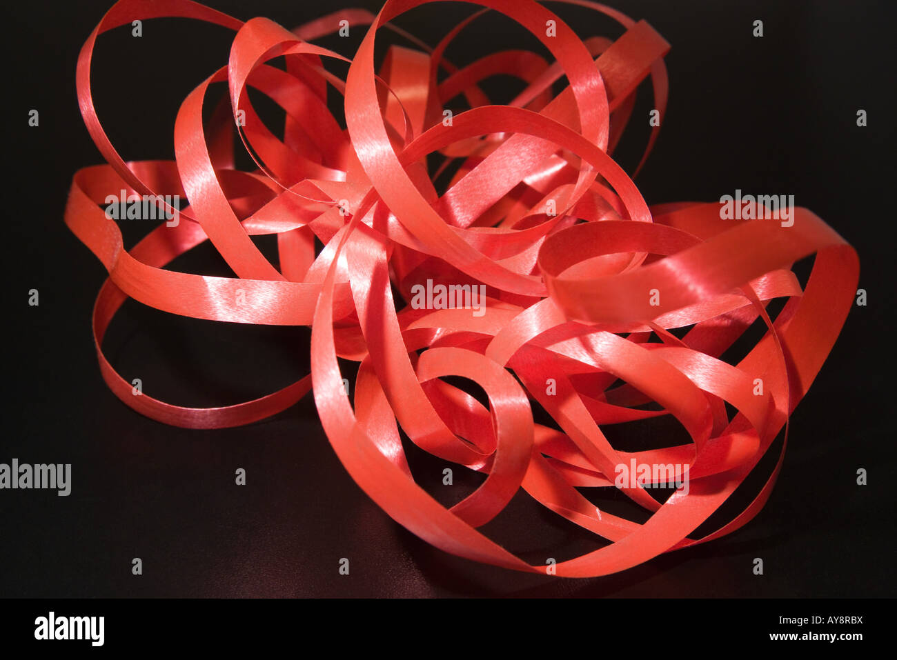 Tangled red ribbon hi-res stock photography and images - Alamy