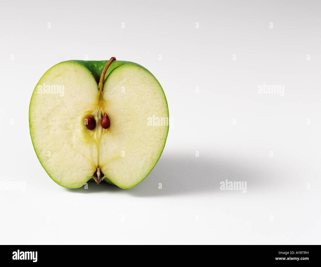 Green apple, cross section, close-up Stock Photo