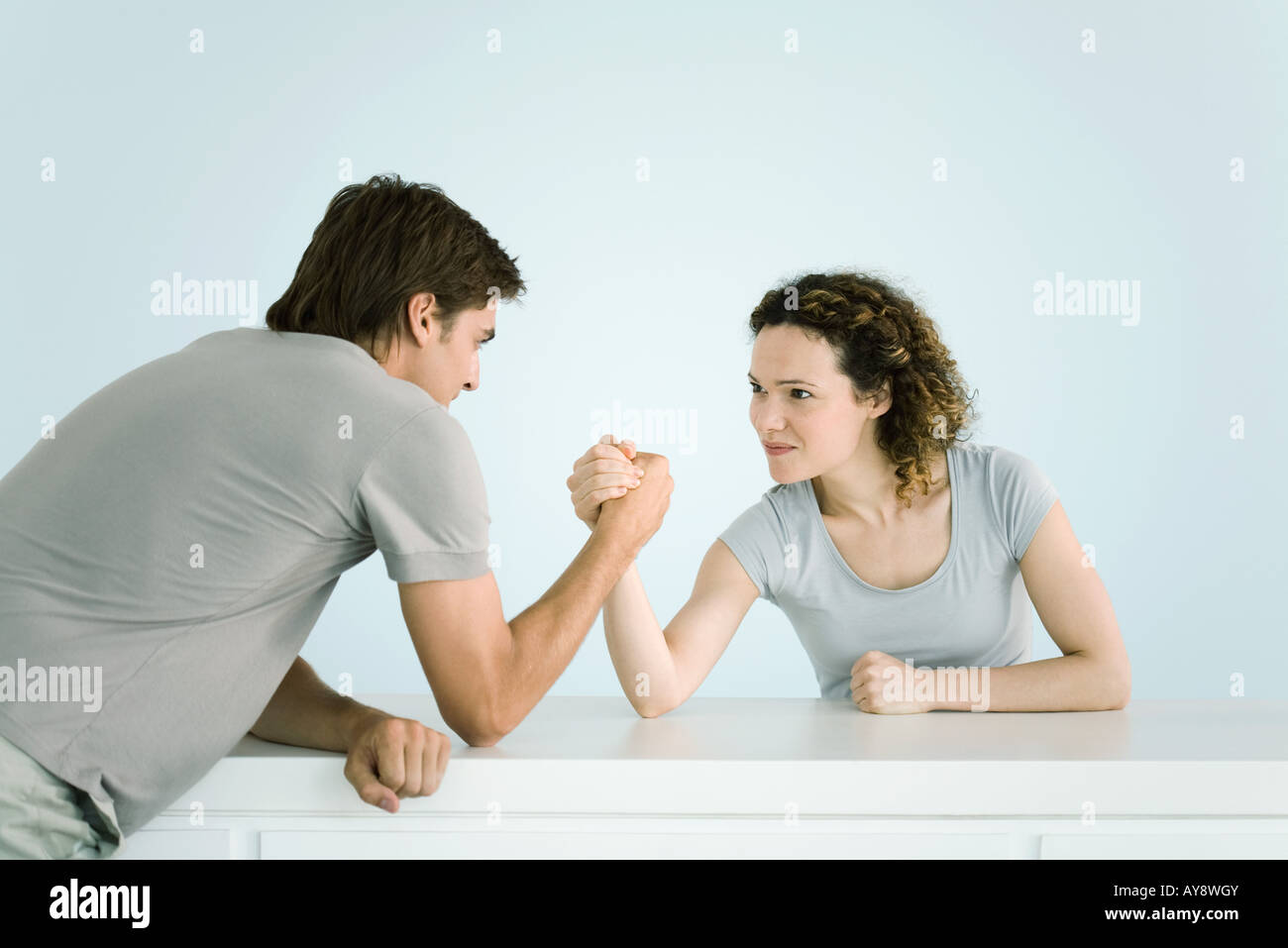 Couple arm wrestling together Stock Photo