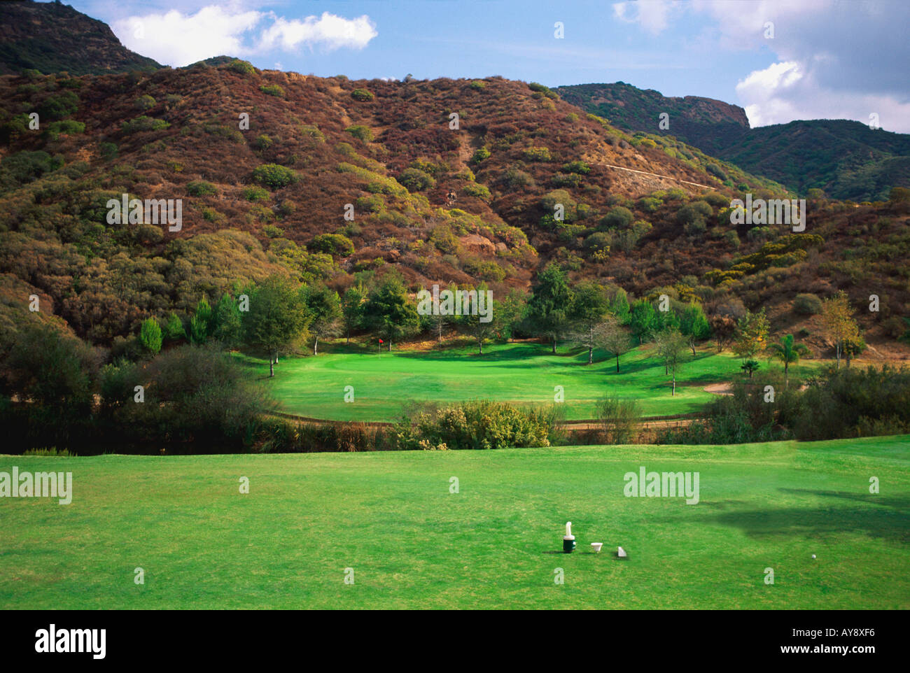 Malibu CA California golf trees water pond bunker green flag flagstick