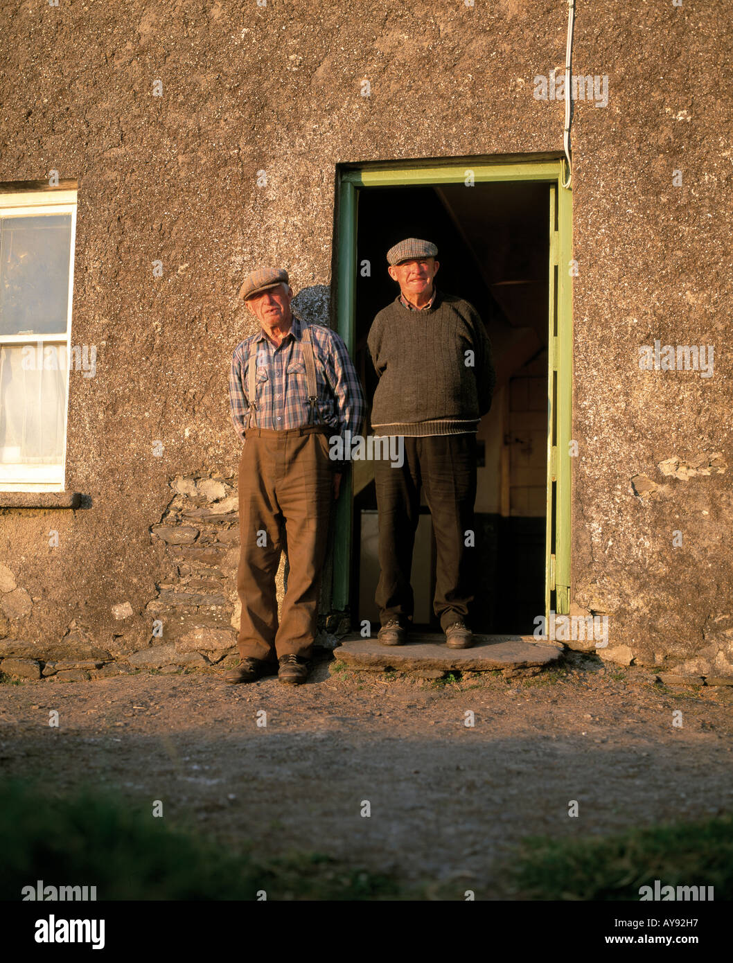 ireland county kerry, dingle peninsula, two elderly irish speaking brothers pose that the door of their dwelling, , Stock Photo