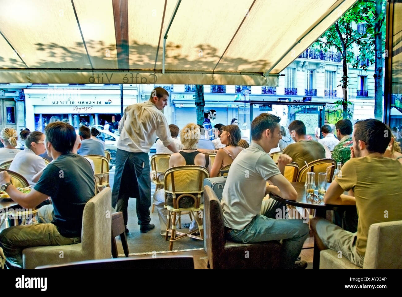 Paris France, Crowd of People, Terrace, French Cafe, Bistro Restaurant Sidewalk terrace Tables, in the Le Marais District,  'Caffe Vito' crowded Stock Photo