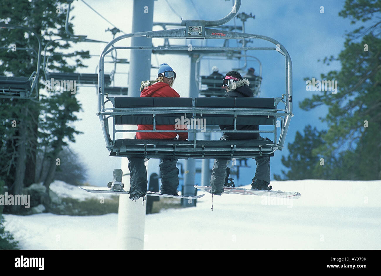 Snowboarders On Chair Lift Big Bear California Stock Photo