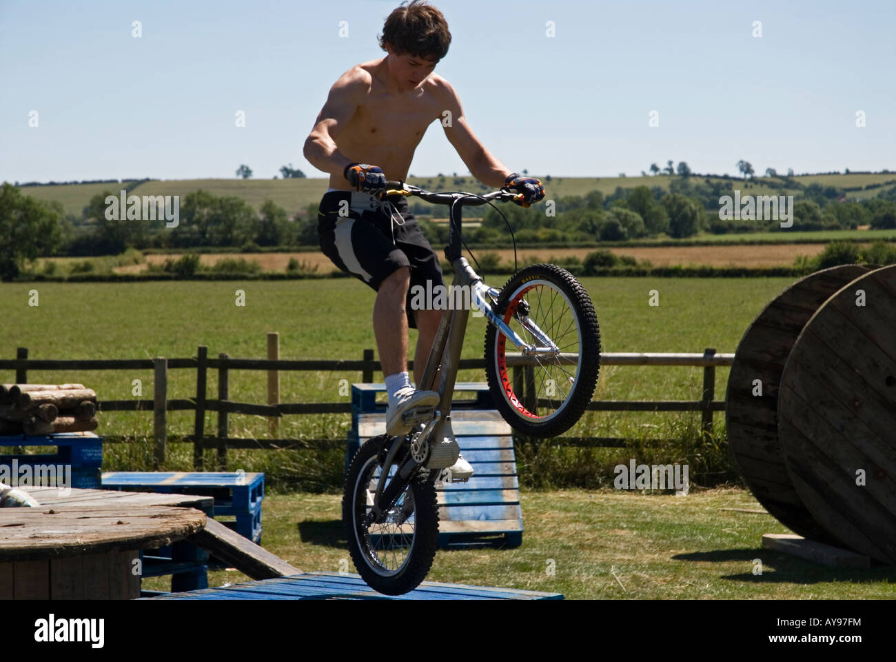 Stock photo of a teenager jumping crates on his BMX bike Stock Photo