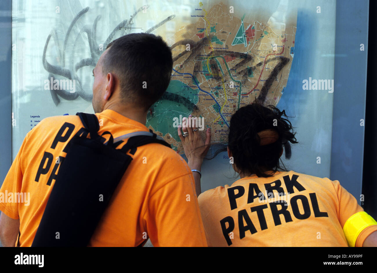 Park patrol wardens looking at a map of central Lisbon, Portugal. Stock Photo