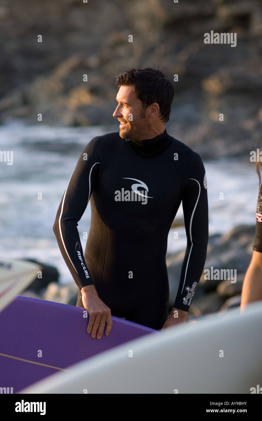 Surfer Gary Green with board and wetsuit, Cornwall, UK Stock Photo