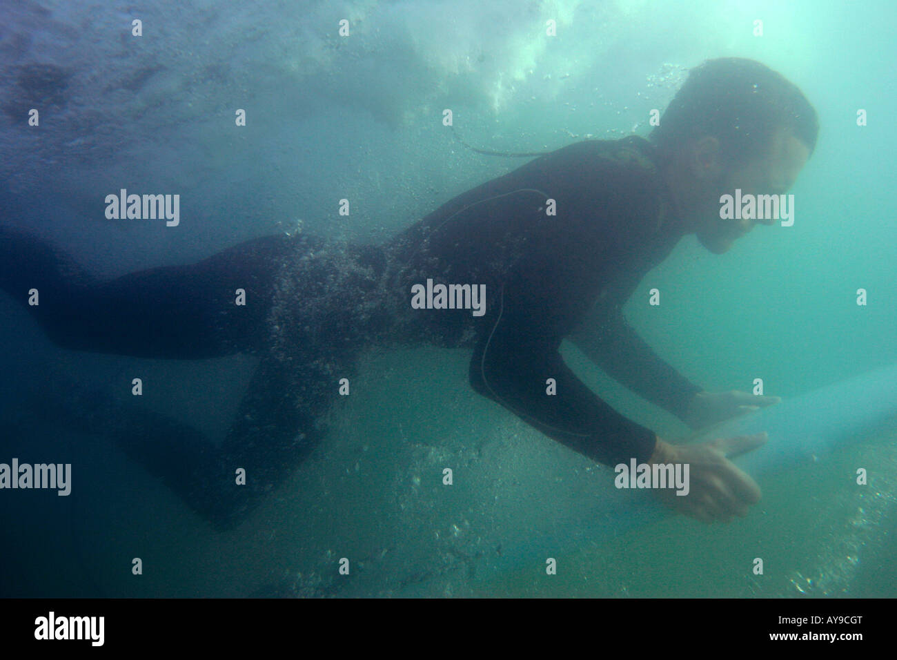 Joss Ash underwater duck diving, Chapel Porth, Cornwall, UK Stock Photo