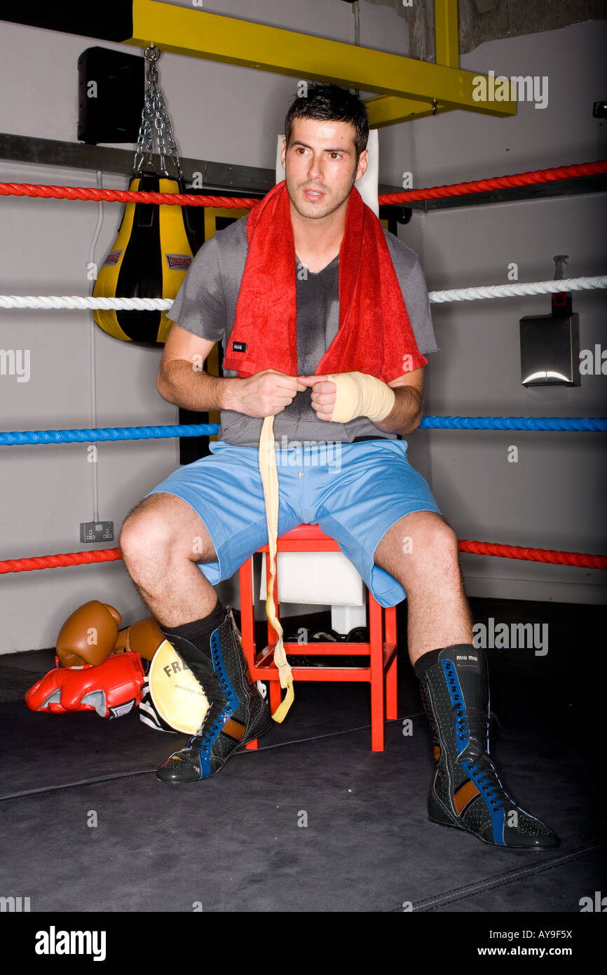 Boxer taping hands in boxing ring Stock Photo Alamy