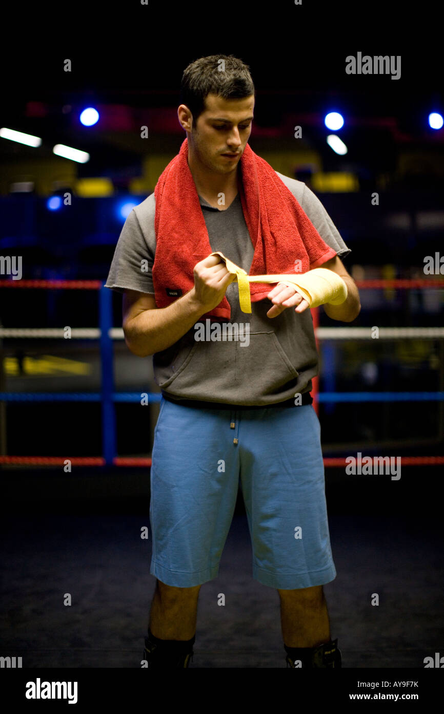 Boxer taping hands in boxing ring Stock Photo Alamy