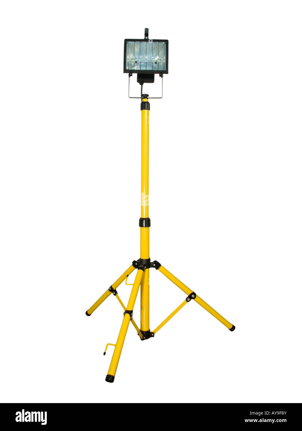 Halogen projector mounted on a tripod isolated on white background ...
