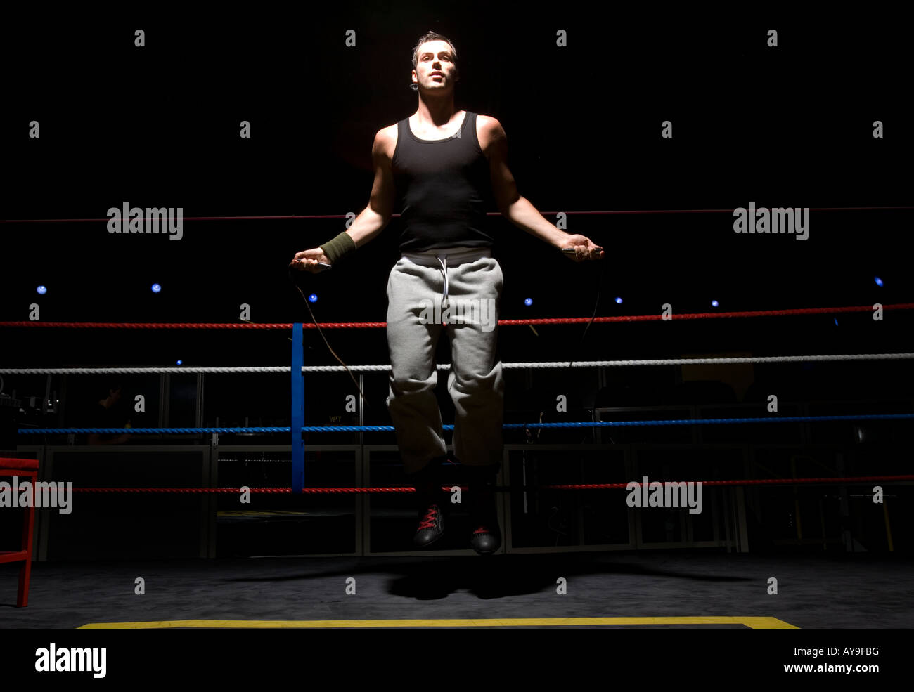 Boxer training with skipping rope in boxing ring Stock Photo Alamy