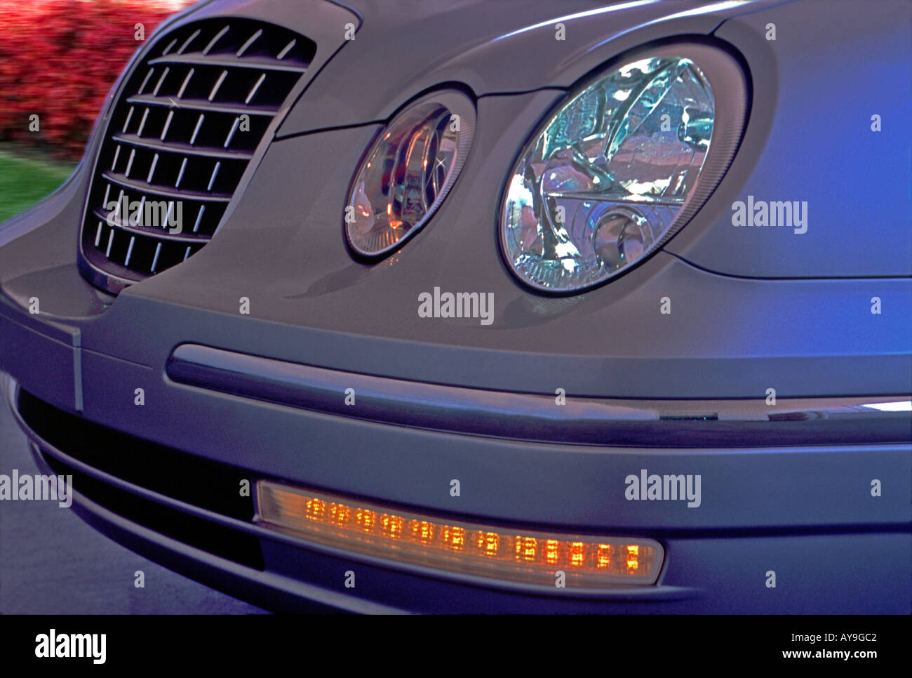 https://c8.alamy.com/comp/AY9GC2/front-sedan-automobile-headlights-on-turn-signal-grille-awesome-grey-AY9GC2.jpg