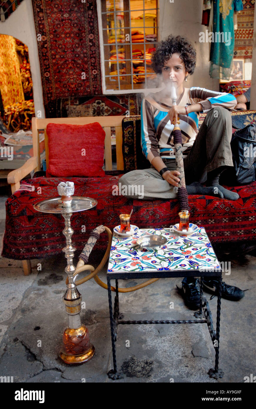 TURKISH FEMALE SMOKING TRADITIONAL PIPE CALLED NARGILE Stock Photo Alamy