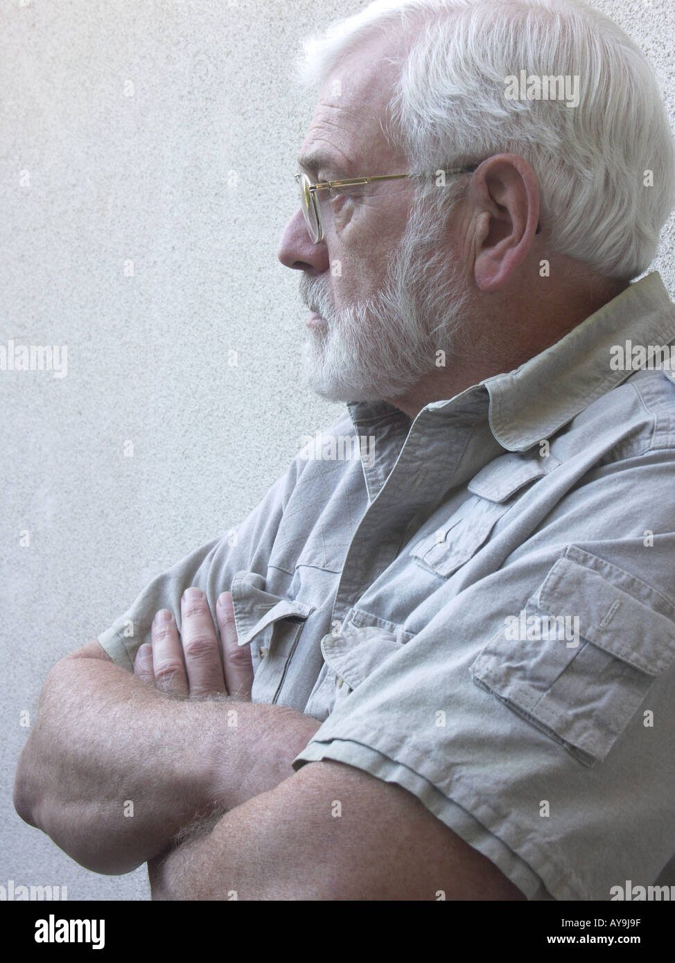 Man leaning against a wall Stock Photo