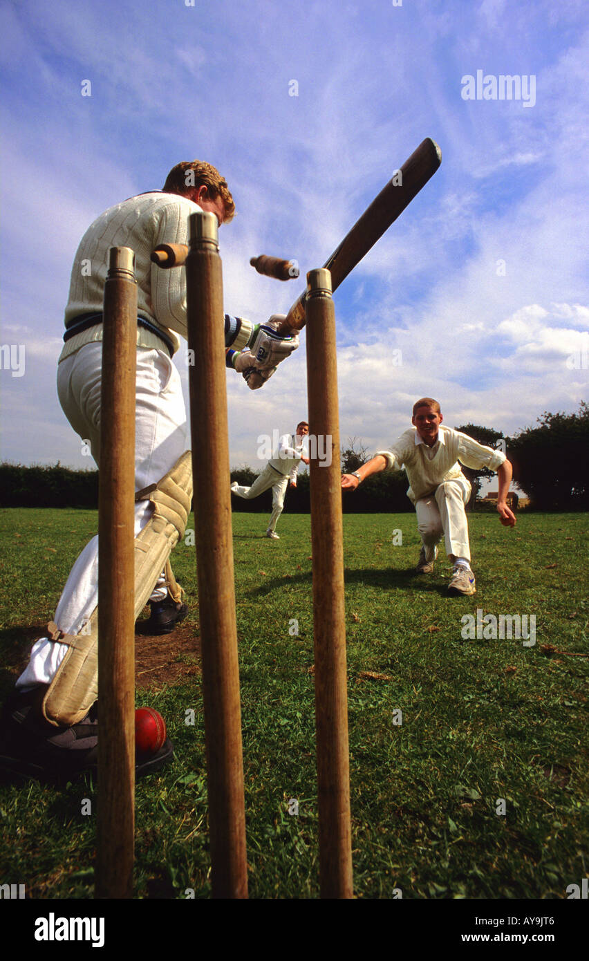 batsman being bowled in cricket match in the village of scholes yorkshire uk Stock Photo