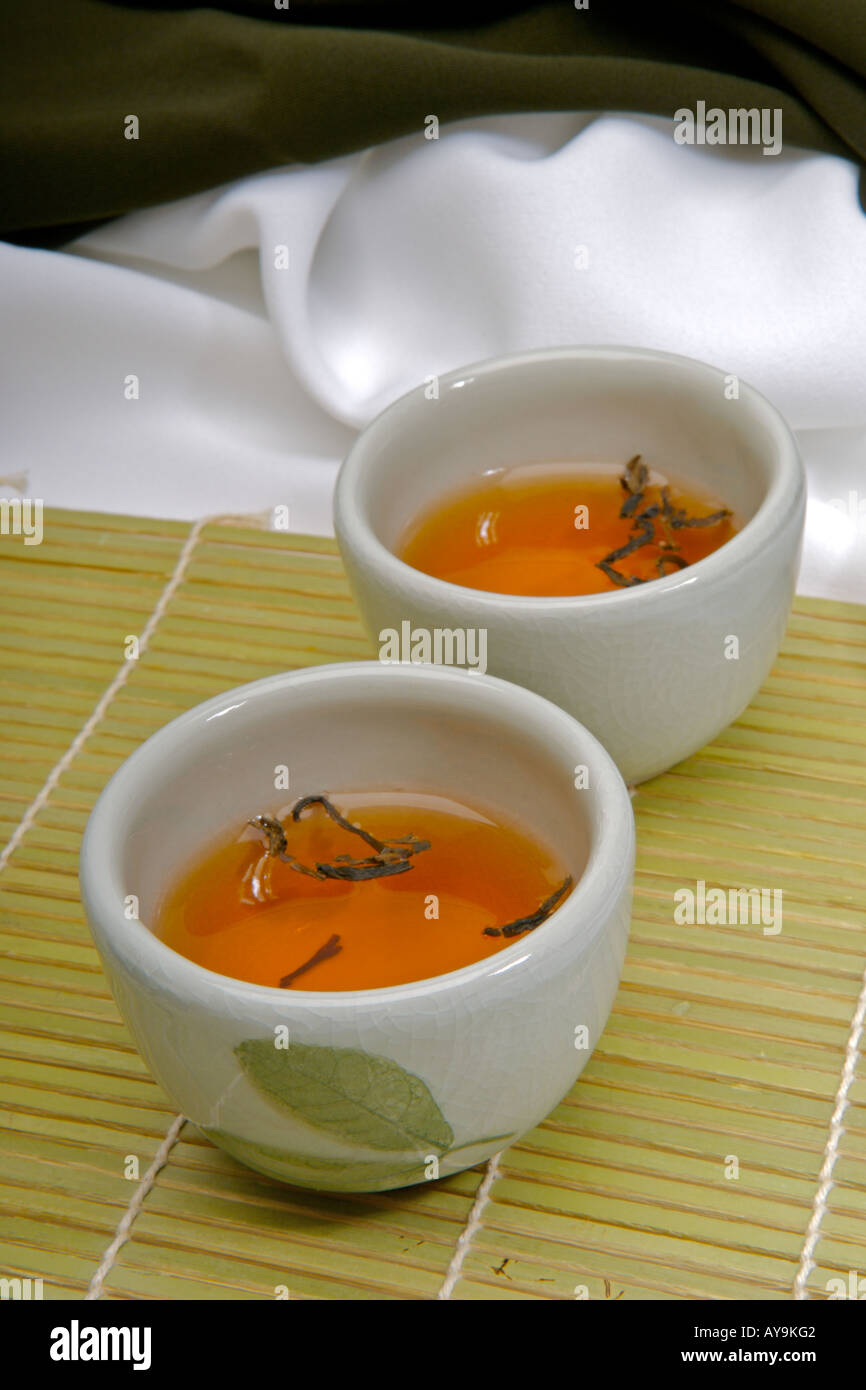 Green chinese tea cups and tea leaves ready to serve tea Stock Photo Alamy